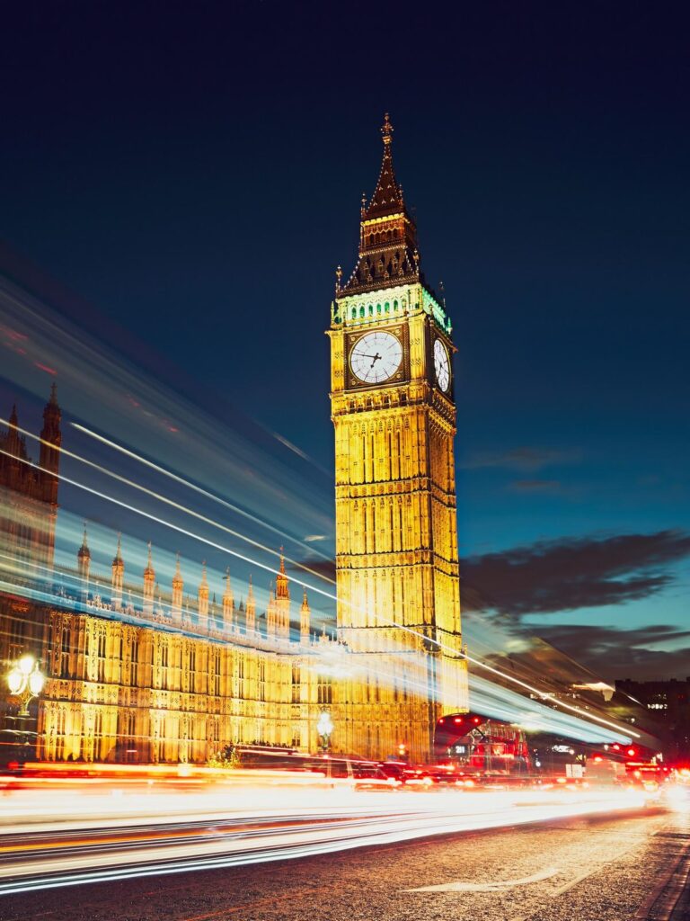 Light trails on the Westminster bridge after sunset. Big Ben and House of Parliament in London, The United Kingdom of Great Britain and Northern Ireland